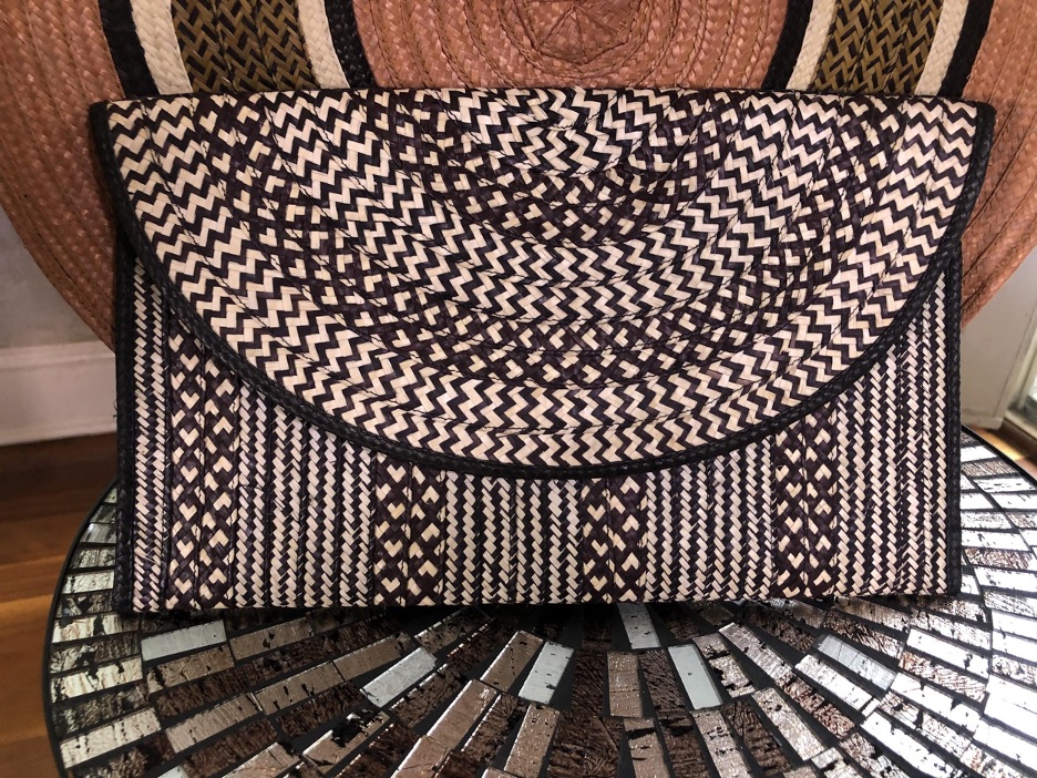 A black and white woven clutch handbag from Sustainable Marketplace