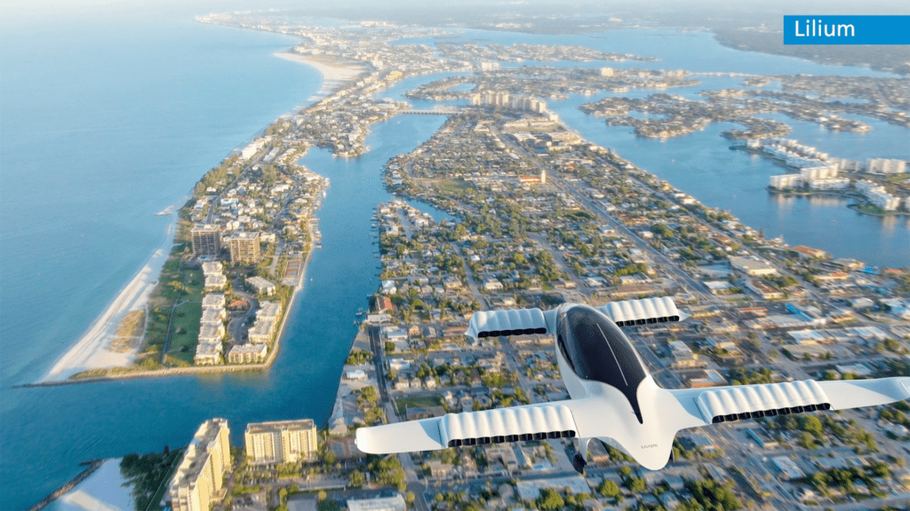 an airplane flying over a coastal town