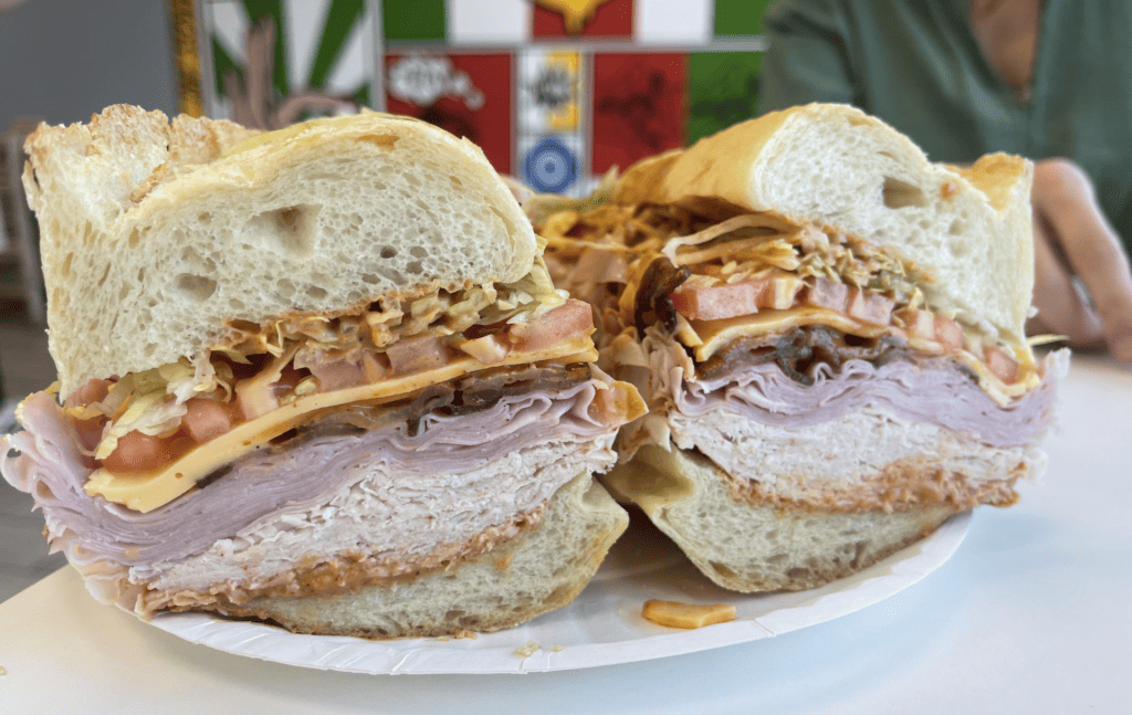 A huge turkey club sandwich