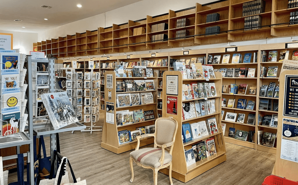 A bookstore with an array of shelves and titles facing the entrance. 