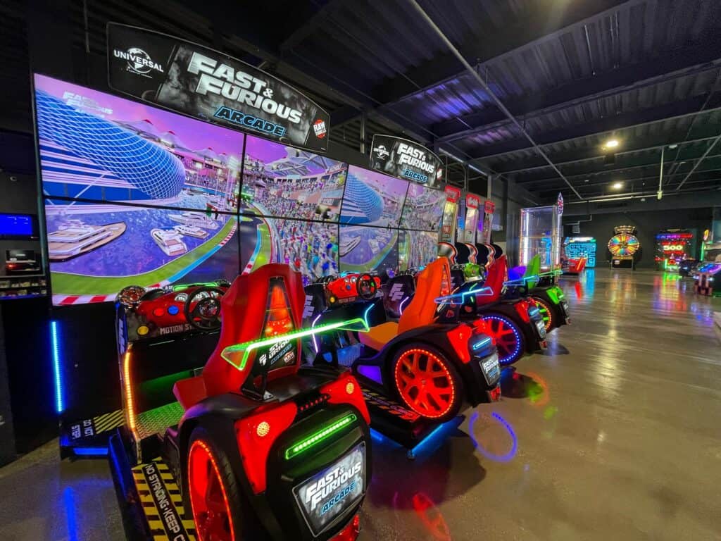 Fast and Furious racing game inside a large arcade. 4 cars are available for players to use. 