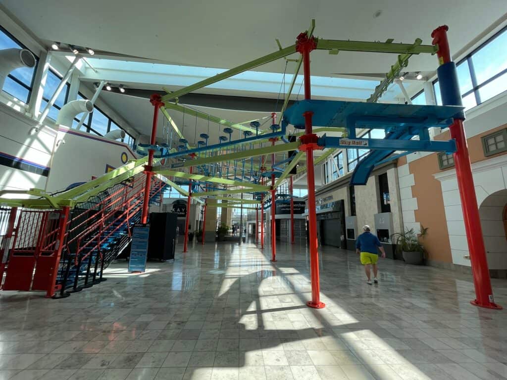 indoor ropes obstacle course elevated inside a shopping mall 